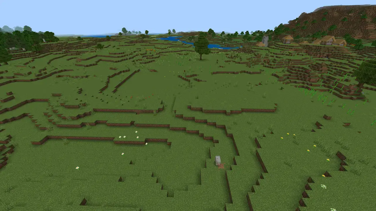 Minecraft plains with a village and river in the distance